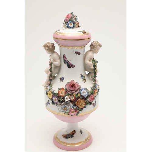 588 - PAIR OF MEISSEN STYLE LIDDED VASES. A pair of large lidded vases or jars, the lids with floral encru... 