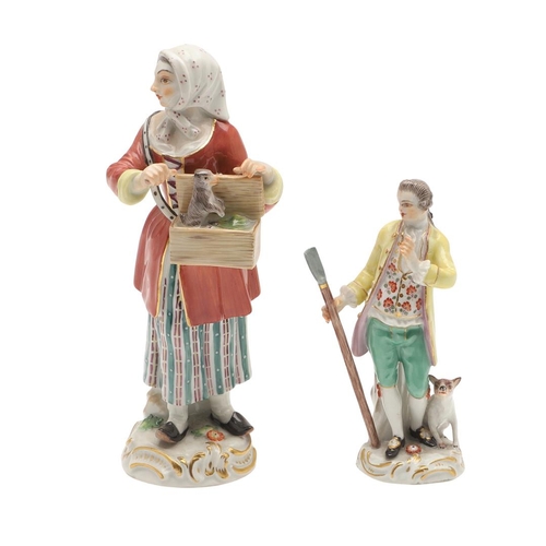 597 - TWO MEISSEN PORCELAIN FIGURES. Including a porcelain figure of a lady holding a box with small anima... 