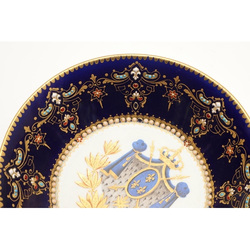 600 - A SEVRES STYLE BLUE GROUND JEWELLED CABINET CUP AND SAUCER. late 19th century, the cup painted with ... 