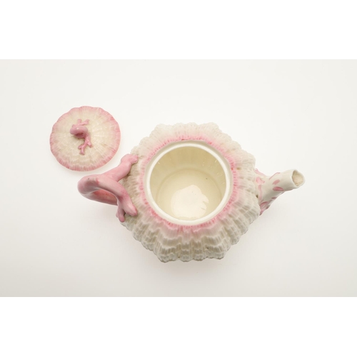 604 - BELLEEK TRAY & TEA SERVICE. A large shell shaped tray with a pink coloured rim (41.5cms across), als... 