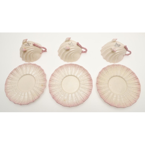 604 - BELLEEK TRAY & TEA SERVICE. A large shell shaped tray with a pink coloured rim (41.5cms across), als... 