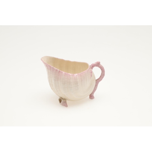 604 - BELLEEK TRAY & TEA SERVICE. A large shell shaped tray with a pink coloured rim (41.5cms across), als... 