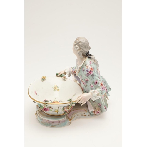 611 - PAIR OF MEISSEN FIGURAL DISHES. A pair of Meissen sweet meat dishes, modelled as a lady and gent hol... 