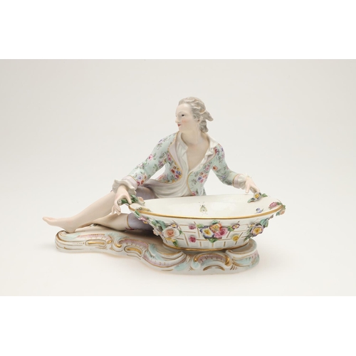 611 - PAIR OF MEISSEN FIGURAL DISHES. A pair of Meissen sweet meat dishes, modelled as a lady and gent hol... 