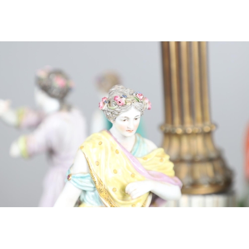 612 - MEISSEN CENTREPIECE - DANCE OF THE HORAE. A large 19thc Meissen centrepiece now converted into a lam... 