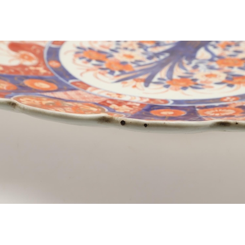 620 - LARGE JAPANESE IMARI CHARGER. Meiji period, an unusually large Imari charger, the fluted body painte... 