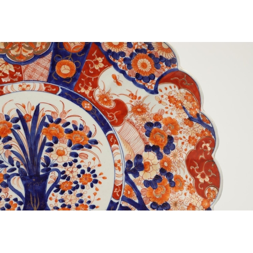 620 - LARGE JAPANESE IMARI CHARGER. Meiji period, an unusually large Imari charger, the fluted body painte... 