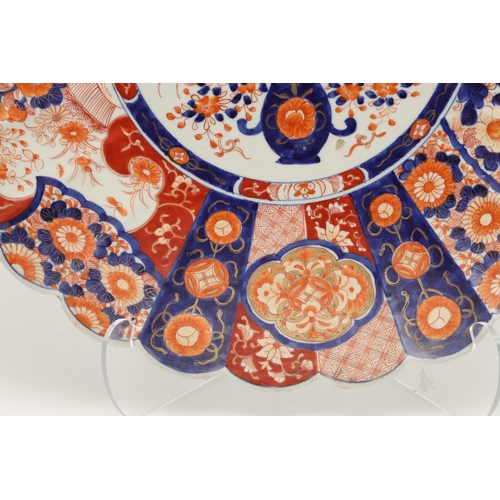 620 - LARGE JAPANESE IMARI CHARGER. Meiji period, an unusually large Imari charger, the fluted body painte... 