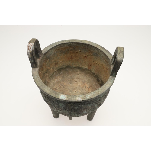 631 - A CHINESE BRONZE ARCHAISTIC STYE BRONZE VESSEL, DING. Probably 20thc, the cup shaped bowl with twin ... 