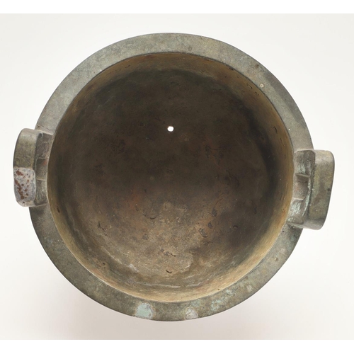 631 - A CHINESE BRONZE ARCHAISTIC STYE BRONZE VESSEL, DING. Probably 20thc, the cup shaped bowl with twin ... 