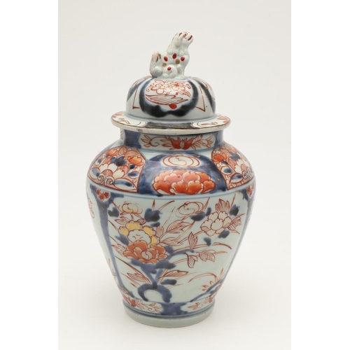 632 - A PAIR OF 19THC JAPANESE IMARI LIDDED JARS. A pair of 19thc Imari lidded jars, with a tapering round... 