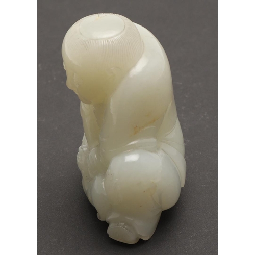 636 - CHINESE CELADON JADE FIGURE. Probably 19thc, a carved celadon jade of a crouching figure, the figure... 