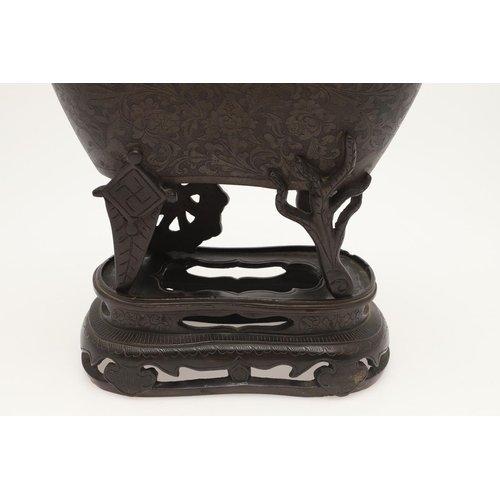 646 - CHINESE BRONZE CENSER & CARVED WOODEN LID. 18th of 19thc, a bronze censer with a foliate design and ... 