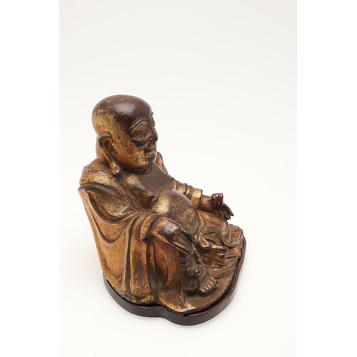 652 - CHINESE GILT BRONZE MODEL OF SEATED BUDAI - MING DYNASTY. A 17thc bronze and gilded figure of a seat... 