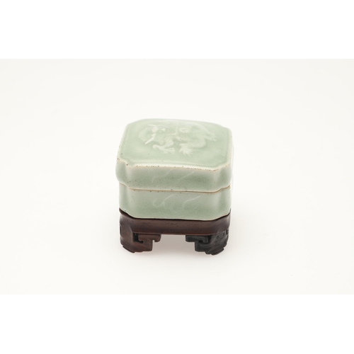 653 - A CHINESE CELADON INK POT ON HARDWOOD STAND, AND A TEA CADDY. Including a Chinese celadon seal paste... 