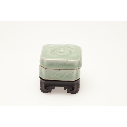 653 - A CHINESE CELADON INK POT ON HARDWOOD STAND, AND A TEA CADDY. Including a Chinese celadon seal paste... 