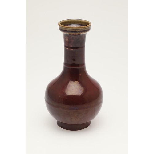 660 - CHINESE 19THC SANG DE BOEUF VASE. A 19thc bottle shaped vase, with a copper red glaze to the body an... 