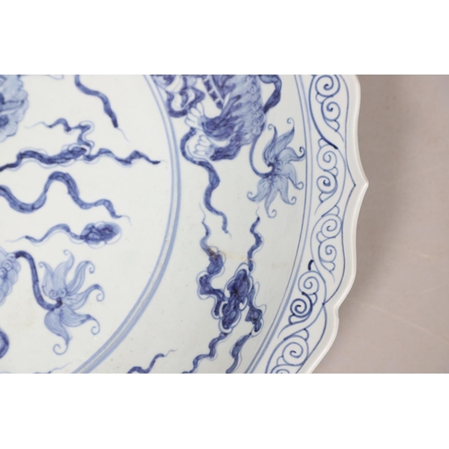 661 - LARGE CHINESE BLUE & WHITE DISH. A large 20thc copy of a Ming Dynasty dish, of unusually large size ... 