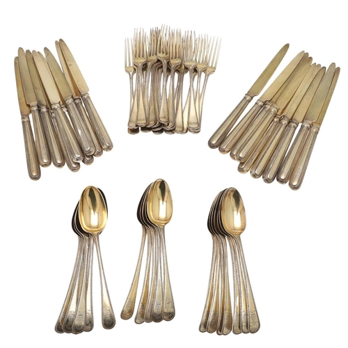 1 - A GEORGE III PART-SERVICE OF SILVERGILT FLATWARE. 18 dessert forks & 18 dessert spoons in Old Englis... 