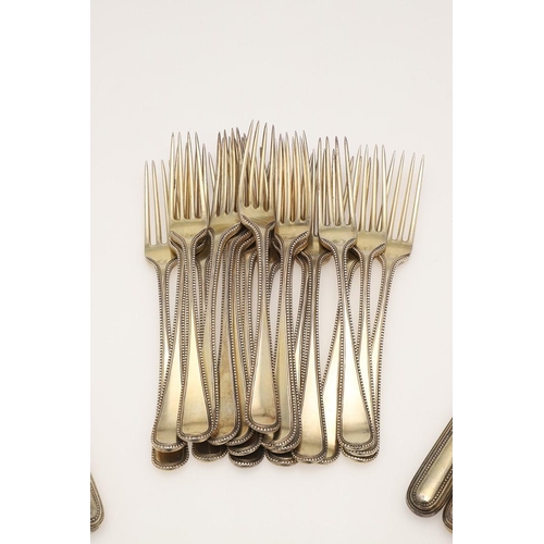 1 - A GEORGE III PART-SERVICE OF SILVERGILT FLATWARE. 18 dessert forks & 18 dessert spoons in Old Englis... 