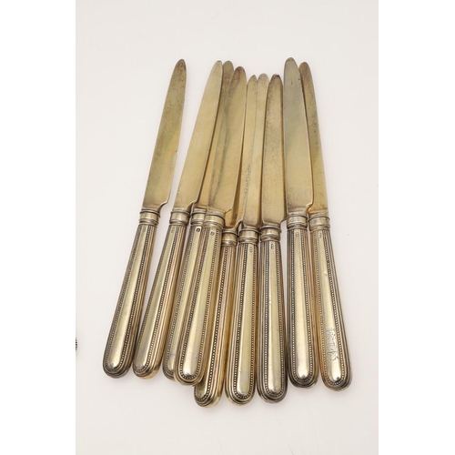 1 - A GEORGE III PART-SERVICE OF SILVERGILT FLATWARE. 18 dessert forks & 18 dessert spoons in Old Englis... 