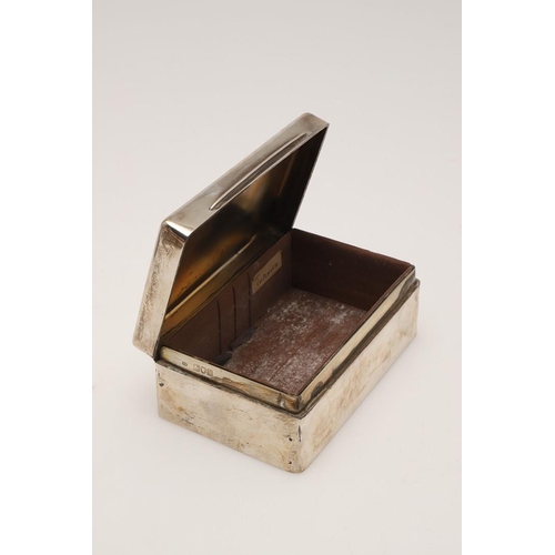 104 - AN EDWARDIAN SILVER CIGARETTE BOX. rectangular form, (cedarwood lining), the cover inscribed 