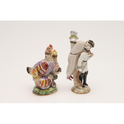 129 - PORCELAIN SCENT BOTTLES. A Sitzendorf bottle of a sportsman with figure on his back,9.5 cm , another... 