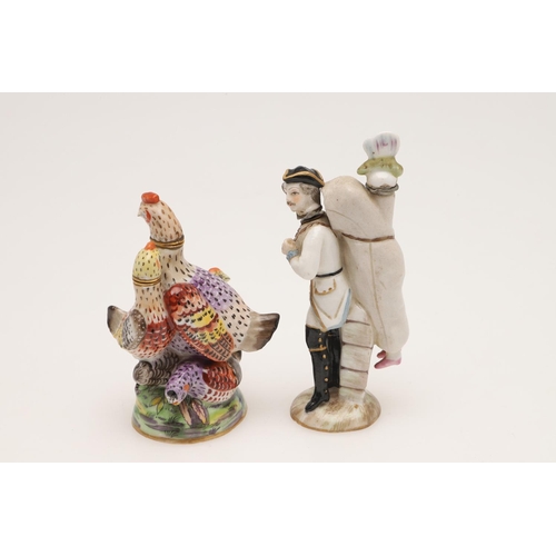 129 - PORCELAIN SCENT BOTTLES. A Sitzendorf bottle of a sportsman with figure on his back,9.5 cm , another... 