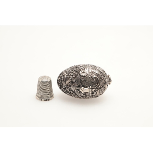 130 - THIMBLE HOLDERS. A Victorian chased silver egg shape example by TJ for Thornhill 1871, 5cm, a George... 