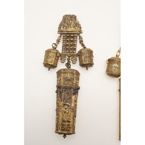 134 - THREE CHATELAINES. one with embossed chinoiserie decoration including a scissors case, another with ... 