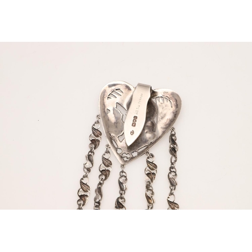 136 - A SILVER CHATELAINE. of Art Nouveau design, the heart shape suspensory panel with female portrait (b... 