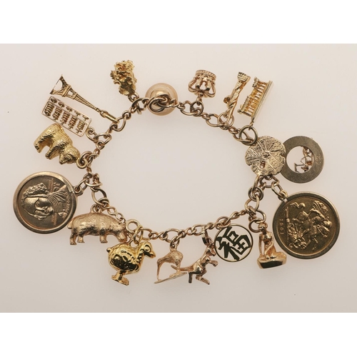 147 - A 9CT GOLD CHARM BRACELET. formed with long and short oval-shaped links, suspending assorted gold ch... 