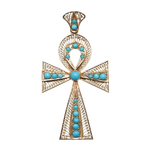 153 - A TURQUOISE AND GOLD CRUCIFORM PENDANT. the gold filigree mounted set with graduated turquoise caboc... 