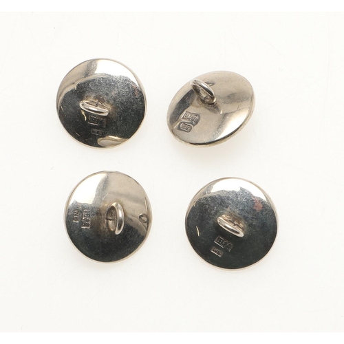 158 - A SET OF FOUR MOTHER OF PEARL DRESS BUTTONS. each mother of pearl link centred with a small pearl an... 