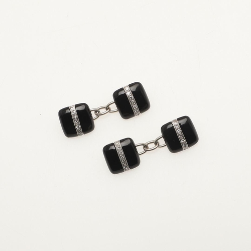 160 - A PAIR OF BLACK ONYX AND DIAMOND CUFFLINKS. each 18ct white gold and black onyx link set with a link... 