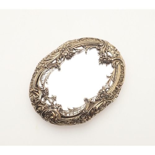 163 - A SILVER GILT COMPACT MIRROR BY BOUCHERON. of oval-shape, each mirrored side enclosed by foliate and... 