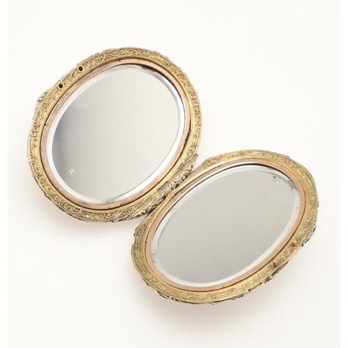 163 - A SILVER GILT COMPACT MIRROR BY BOUCHERON. of oval-shape, each mirrored side enclosed by foliate and... 