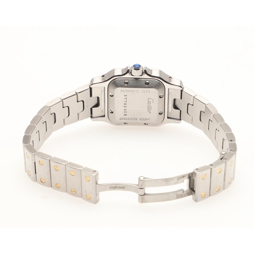 179 - A LADY'S STAINLESS STEEL AND GOLD AUTOMATIC SANTOS WRISTWATCH BY CARTIER. the signed square-shaped d... 