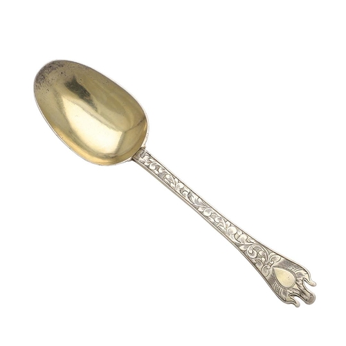 18 - A WILLIAM & MARY SILVERGILT TREFID SPOON. dessert-spoon in size, with a ribbed rattail and engraved ... 