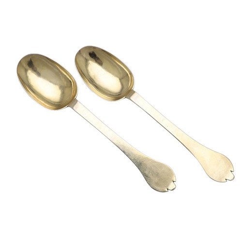 19 - A PAIR OF WILLIAM III SILVERGILT TREFID SPOONS. with beaded rattails and prick-engraved initials 