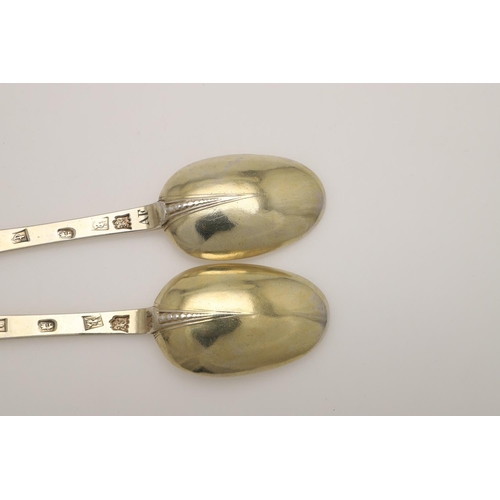 19 - A PAIR OF WILLIAM III SILVERGILT TREFID SPOONS. with beaded rattails and prick-engraved initials 