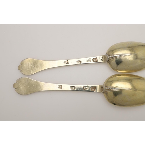 19 - A PAIR OF WILLIAM III SILVERGILT TREFID SPOONS. with beaded rattails and prick-engraved initials 