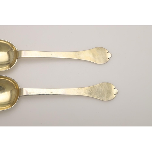 19 - A PAIR OF WILLIAM III SILVERGILT TREFID SPOONS. with beaded rattails and prick-engraved initials 