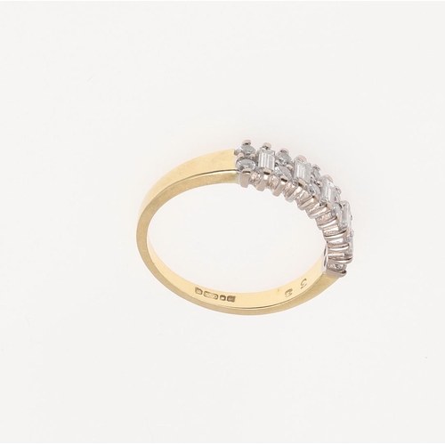 190 - A DIAMOND HALF HOOP RING. mounted alternately with baguette-cut diamonds and pairs of circular-cut d... 