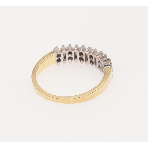 190 - A DIAMOND HALF HOOP RING. mounted alternately with baguette-cut diamonds and pairs of circular-cut d... 