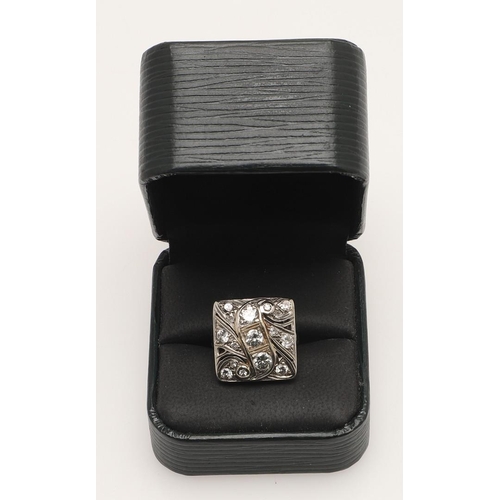 201 - A DIAMOND CLUSTER RING. the square-shaped ring mounted with graduated circular-cut diamonds, in 14ct... 