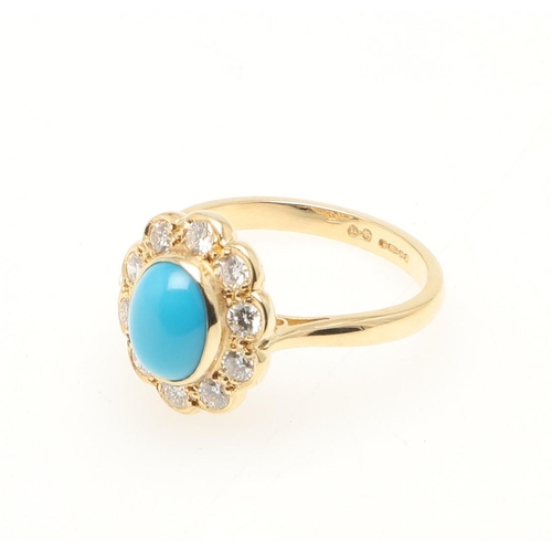 207 - A TURQUOISE AND DIAMOND CLUSTER RING. the oval-shaped turquoise cabochon is set within a surround of... 