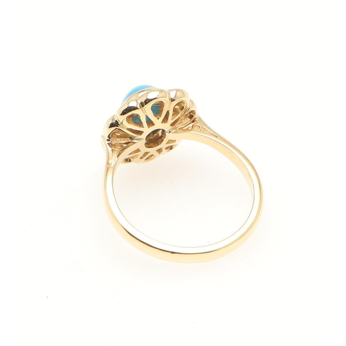 207 - A TURQUOISE AND DIAMOND CLUSTER RING. the oval-shaped turquoise cabochon is set within a surround of... 