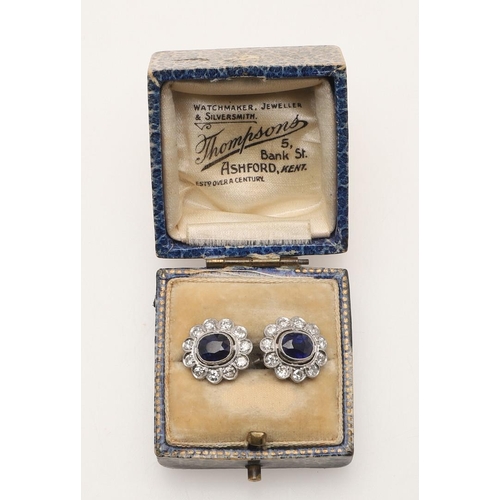 233 - A PAIR OF SAPPHIRE AND DIAMOND CLUSTER EARRINGS. each earring set with an oval-shaped sapphire withi... 