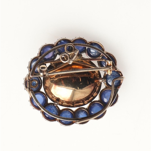 234 - A NATURAL BLISTER PEARL AND SAPPHIRE BROOCH. the central blister pearl is set within a surround of c... 